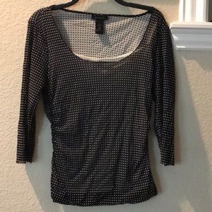 Black and white polka dot blouse.